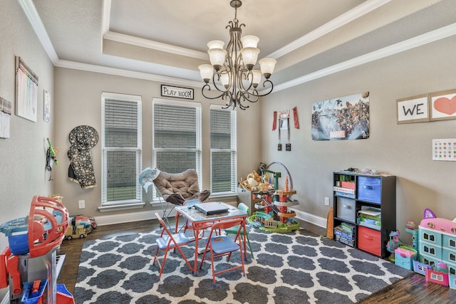 183 Melbourne Dr, Willow Park, TX 76087 - playroom featuring wood finished floors, a chandelier, crown molding, a tray ceiling, and baseboards