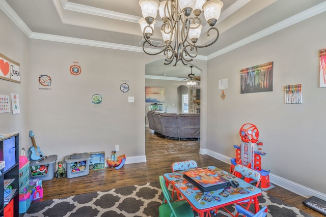 183 Melbourne Dr, Willow Park, TX 76087 - recreation room with ceiling fan, arched walkways, wood finished floors, a chandelier, and crown molding