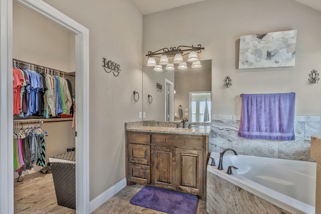 183 Melbourne Dr, Willow Park, TX 76087 - full bathroom featuring a garden tub, vanity, and a spacious closet