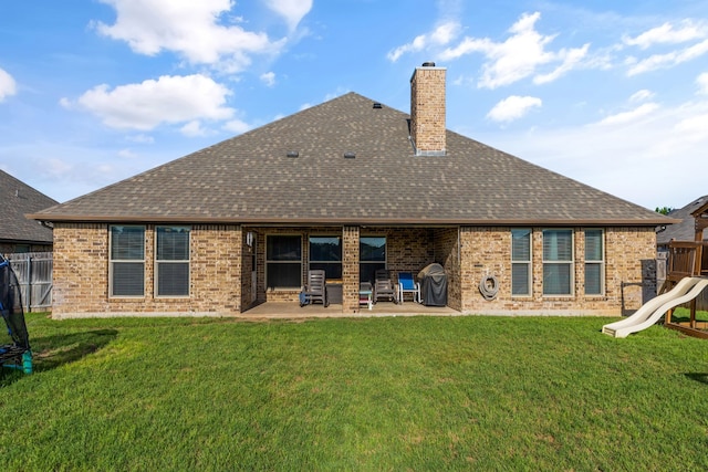 183 Melbourne Dr, Willow Park, TX 76087 - rear view of property featuring roof with shingles, a patio, a chimney, and brick siding