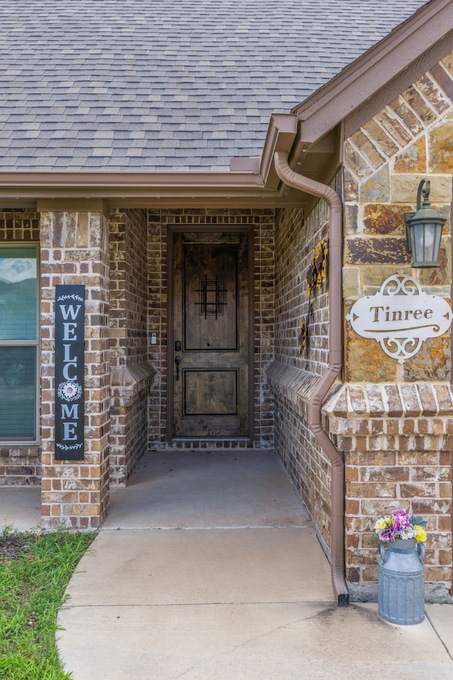 183 Melbourne Dr, Willow Park, TX 76087 - doorway to property with a shingled roof and brick siding