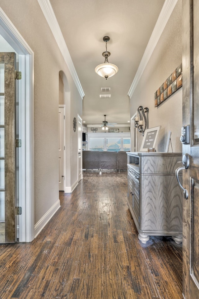 183 Melbourne Dr, Willow Park, TX 76087 - hallway with dark wood-style flooring, arched walkways, crown molding, and baseboards