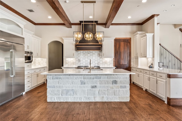 784 Cimarron Ct, Argyle, TX 76226 - kitchen featuring stainless steel appliances, dark wood finished floors, white cabinets, a sink, and beam ceiling