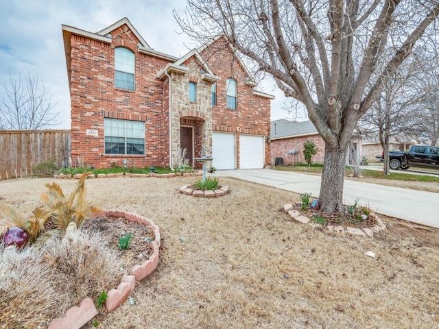 2852 Ector Dr, Grand Prairie, TX 75052 - traditional home featuring concrete driveway, brick siding, a garage, and stone siding