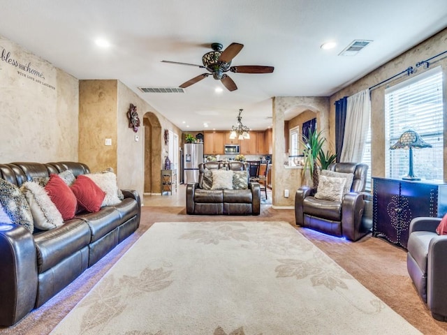 2852 Ector Dr, Grand Prairie, TX 75052 - living area featuring arched walkways, ceiling fan, recessed lighting, a chandelier, and light colored carpet
