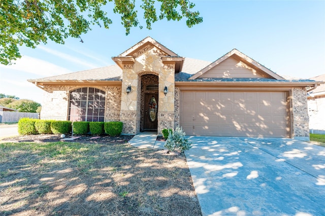 143 Valley Ranch Dr, Waxahachie, TX 75165 - french provincial home featuring brick siding, a garage, concrete driveway, and a shingled roof