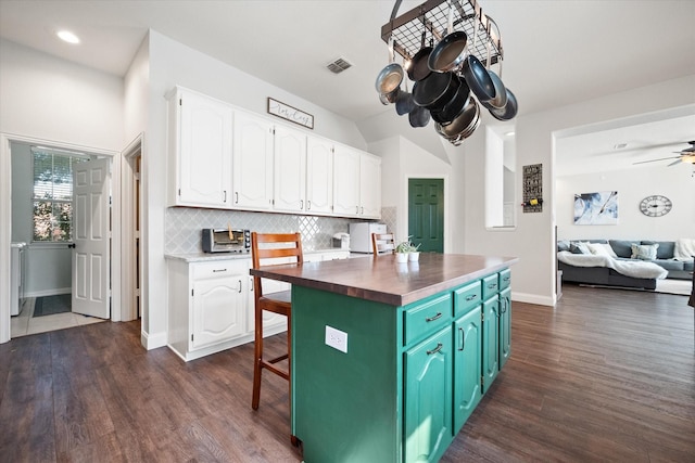 1817 Meadow Ridge Dr, Flower Mound, TX 75028 - kitchen with butcher block countertops, white cabinets, dark wood-style floors, open floor plan, and recessed lighting