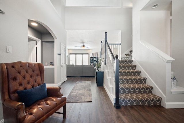 1817 Meadow Ridge Dr, Flower Mound, TX 75028 - entrance foyer featuring ceiling fan, wood finished floors, arched walkways, stairs, and baseboards