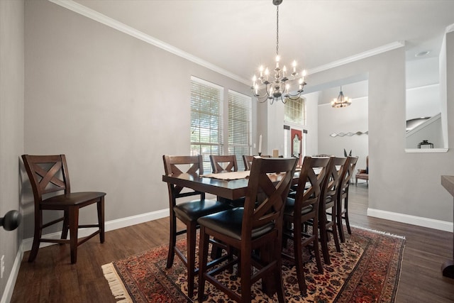1817 Meadow Ridge Dr, Flower Mound, TX 75028 - dining area with a chandelier, dark wood finished floors, crown molding, and baseboards