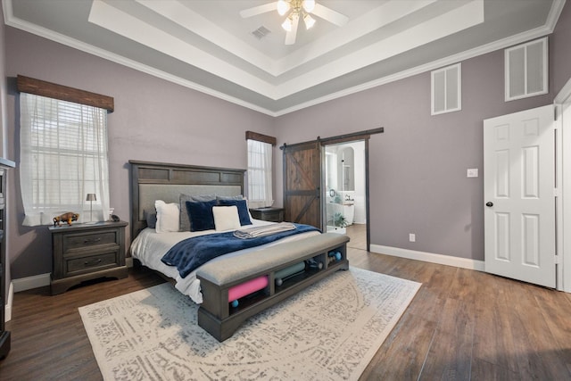 1817 Meadow Ridge Dr, Flower Mound, TX 75028 - bedroom with a raised ceiling, dark wood finished floors, baseboards, a barn door, and crown molding