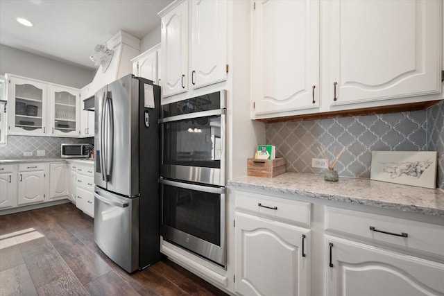 1817 Meadow Ridge Dr, Flower Mound, TX 75028 - kitchen with stainless steel appliances, backsplash, white cabinets, and recessed lighting