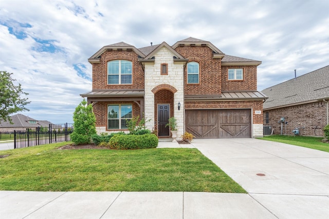 2536 Governors Blvd, Heath, TX 75126 - french provincial home featuring a standing seam roof, an attached garage, driveway, stone siding, and a shingled roof