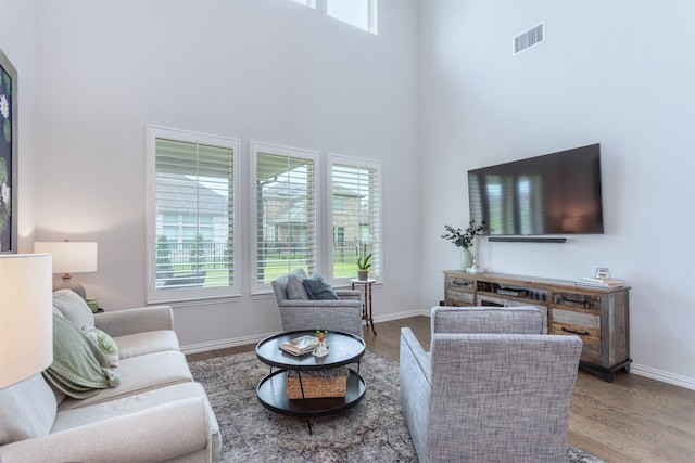 2536 Governors Blvd, Heath, TX 75126 - living area featuring a towering ceiling, plenty of natural light, and wood finished floors