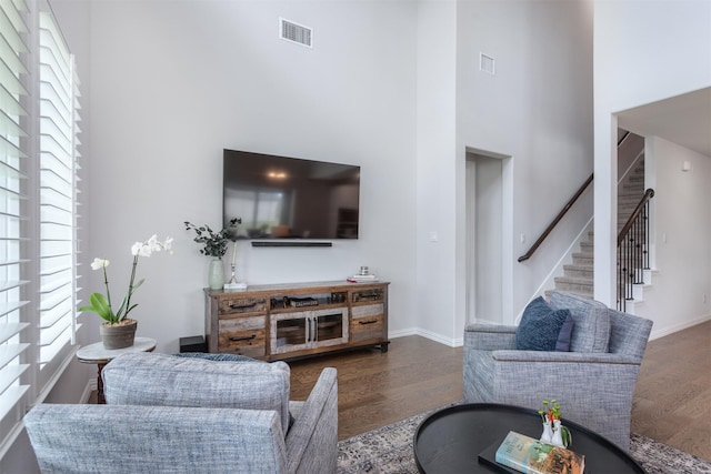 2536 Governors Blvd, Heath, TX 75126 - living area with a high ceiling, wood finished floors, stairs, and baseboards