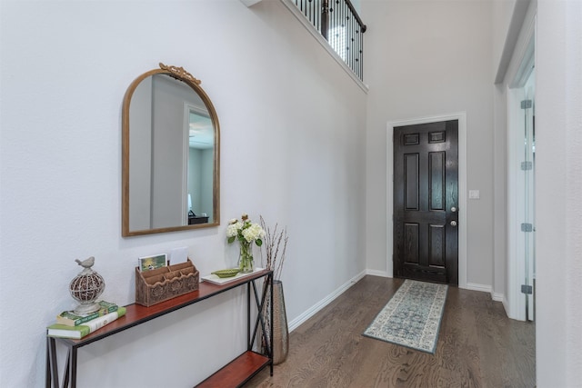 2536 Governors Blvd, Heath, TX 75126 - foyer featuring dark wood-type flooring, baseboards, and a towering ceiling