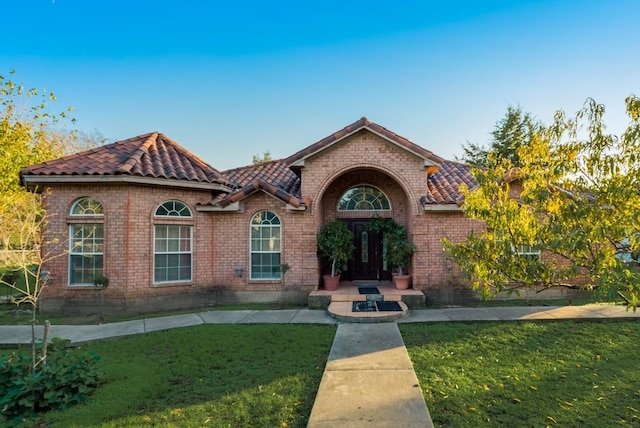 5310 Ranchero Ln, Dallas, TX 75236 - view of front facade with a front yard, a tiled roof, and brick siding