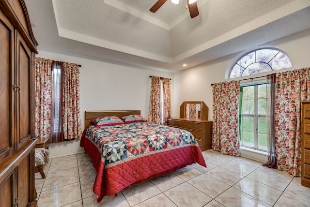 5310 Ranchero Ln, Dallas, TX 75236 - bedroom featuring a raised ceiling and a ceiling fan