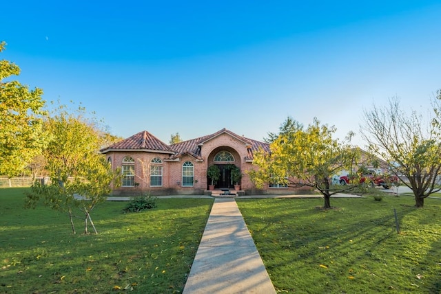 5310 Ranchero Ln, Dallas, TX 75236 - mediterranean / spanish-style home featuring a tiled roof and brick siding