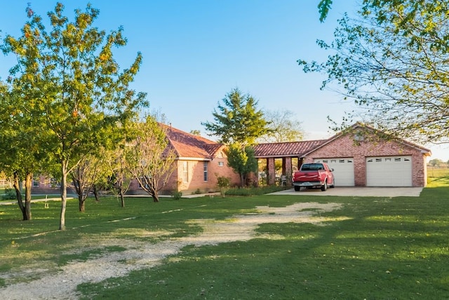 5310 Ranchero Ln, Dallas, TX 75236 - view of front of home with a front lawn, an attached garage, and dirt driveway