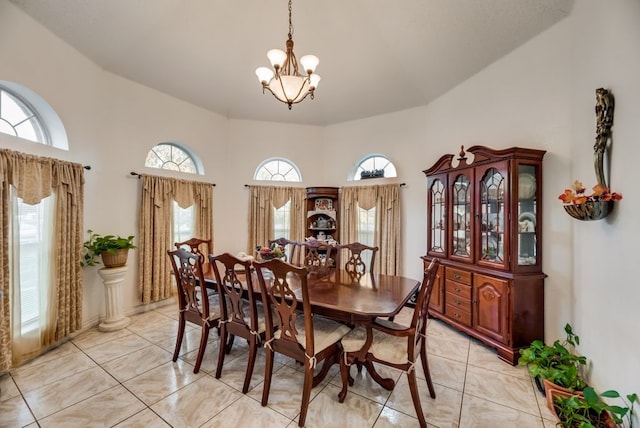 5310 Ranchero Ln, Dallas, TX 75236 - dining room featuring a chandelier and a towering ceiling