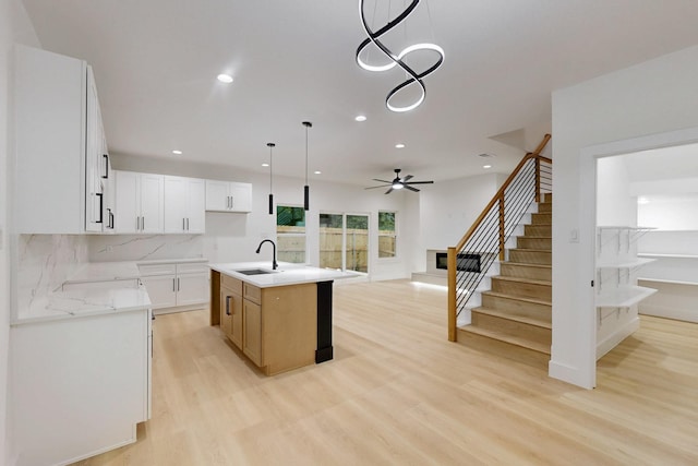 4519 Wahoo St, Dallas, TX 75210 - kitchen featuring light wood-type flooring, ceiling fan, pendant lighting, open floor plan, and recessed lighting