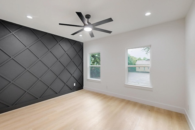 4519 Wahoo St, Dallas, TX 75210 - empty room featuring baseboards, wood finished floors, a ceiling fan, recessed lighting, and a decorative wall
