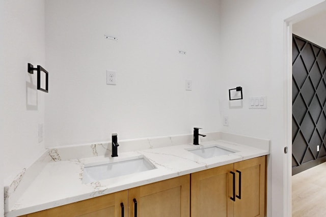 4519 Wahoo St, Dallas, TX 75210 - bathroom featuring double vanity and wood finished floors
