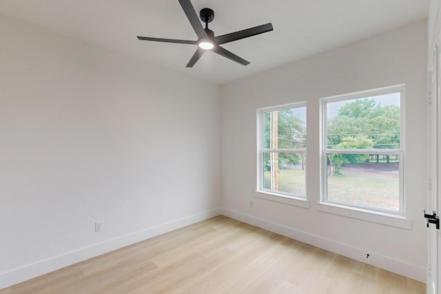 4519 Wahoo St, Dallas, TX 75210 - unfurnished room featuring light wood-style floors, baseboards, and a ceiling fan