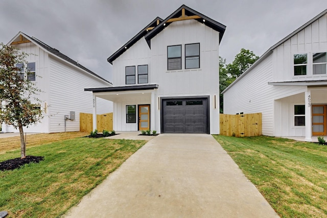 4519 Wahoo St, Dallas, TX 75210 - modern farmhouse style home featuring board and batten siding, a garage, and driveway