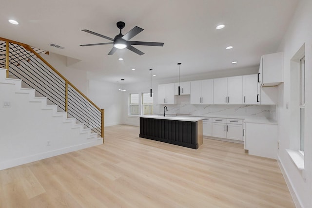 4519 Wahoo St, Dallas, TX 75210 - kitchen with light wood-type flooring, recessed lighting, an island with sink, a ceiling fan, and a sink