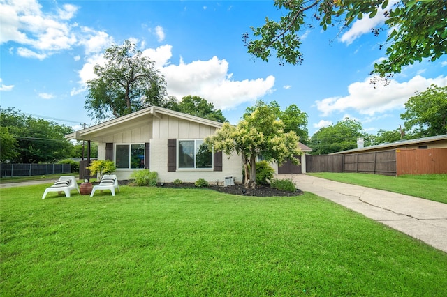 746 Greenhaven Dr, Richardson, TX 75080 - view of front of house with driveway, board and batten siding, and brick siding