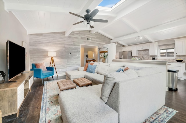 746 Greenhaven Dr, Richardson, TX 75080 - living area with dark wood-style flooring, ceiling fan, and a skylight