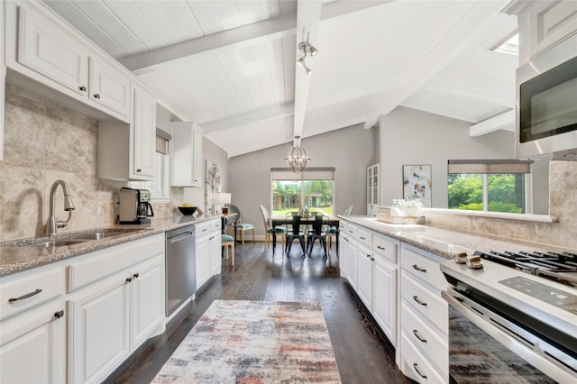 746 Greenhaven Dr, Richardson, TX 75080 - kitchen featuring a sink, stainless steel appliances, a chandelier, backsplash, and dark wood-style floors