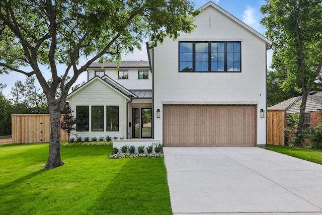 6607 Kenwell St, Dallas, TX 75209 - view of front of property featuring a standing seam roof, concrete driveway, a garage, and metal roof