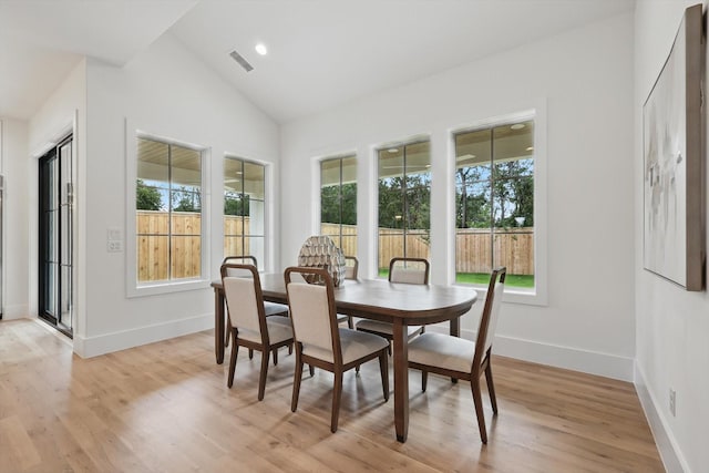 6607 Kenwell St, Dallas, TX 75209 - dining space featuring plenty of natural light, vaulted ceiling, light wood-style flooring, and baseboards