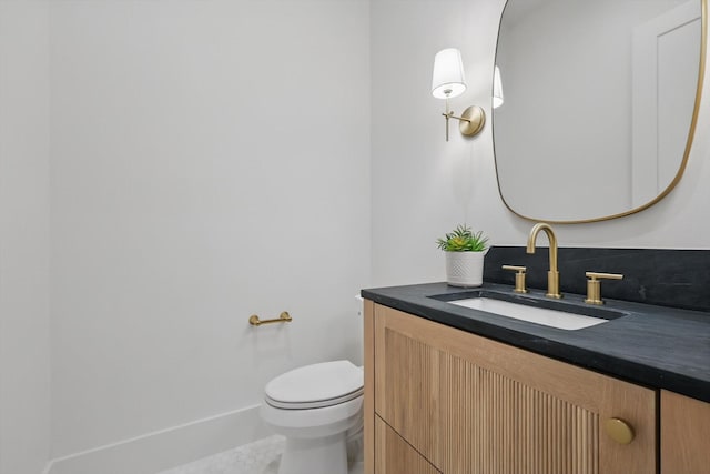6607 Kenwell St, Dallas, TX 75209 - bathroom with vanity, toilet, and baseboards