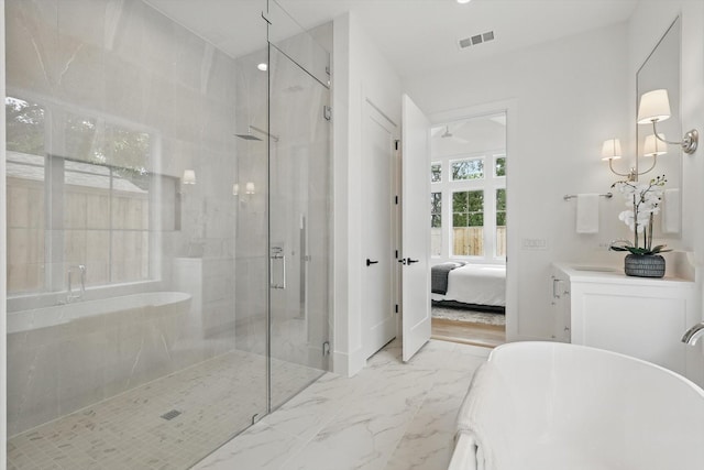 6607 Kenwell St, Dallas, TX 75209 - ensuite bathroom with a freestanding tub, a stall shower, marble finish flooring, vanity, and ceiling fan