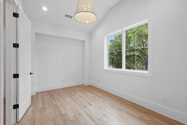 6607 Kenwell St, Dallas, TX 75209 - empty room with baseboards, light wood finished floors, vaulted ceiling, and recessed lighting