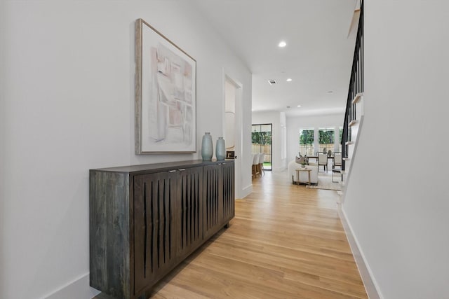6607 Kenwell St, Dallas, TX 75209 - hallway with light wood-style flooring, recessed lighting, and baseboards