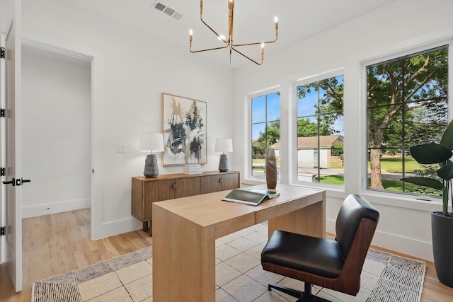6607 Kenwell St, Dallas, TX 75209 - home office featuring a chandelier, baseboards, and light wood-style flooring