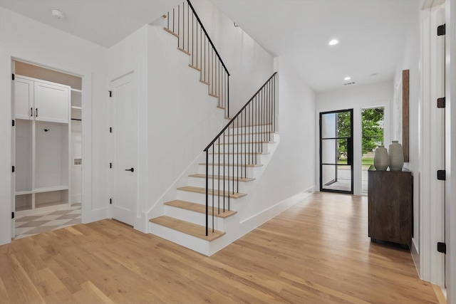 6607 Kenwell St, Dallas, TX 75209 - foyer entrance featuring light wood-style flooring, stairway, recessed lighting, and baseboards