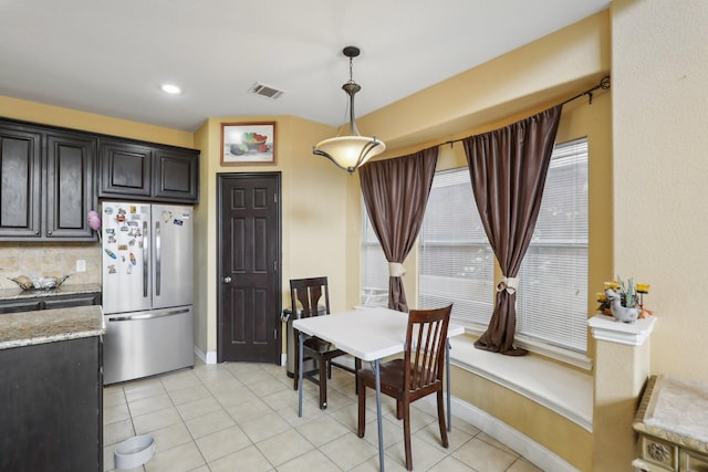5400 Ivyridge Ln, Mckinney, TX 75071 - dining space featuring baseboards, light tile patterned floors, and recessed lighting