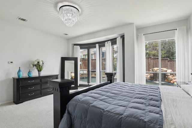 5400 Ivyridge Ln, Mckinney, TX 75071 - bedroom with light carpet, a chandelier, and access to outside