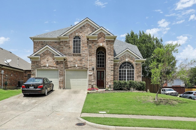5400 Ivyridge Ln, Mckinney, TX 75071 - traditional-style house with an attached garage, driveway, brick siding, and a shingled roof