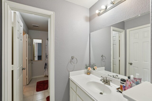 5400 Ivyridge Ln, Mckinney, TX 75071 - full bathroom with vanity, tile patterned flooring, and baseboards