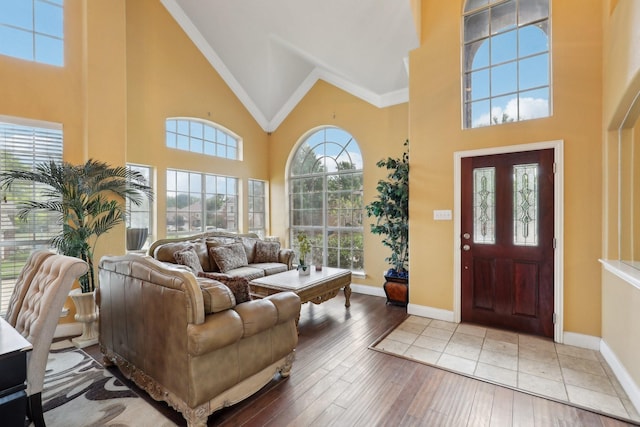 5400 Ivyridge Ln, Mckinney, TX 75071 - entrance foyer with high vaulted ceiling, hardwood / wood-style floors, crown molding, and baseboards