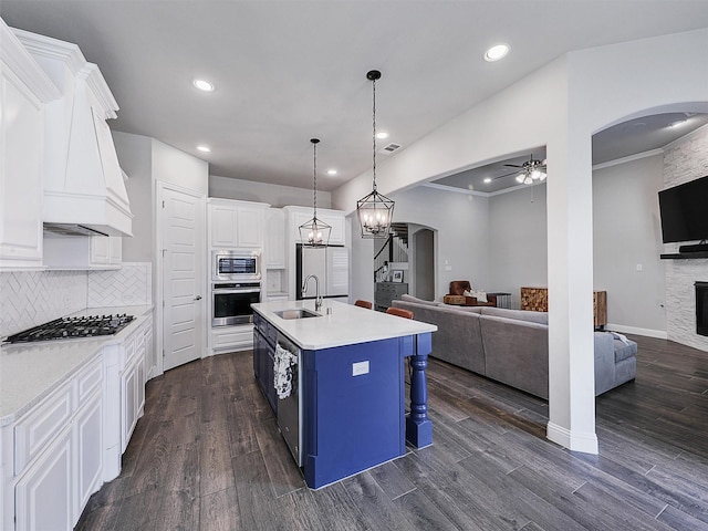 2815 Spring Creek Trl, Celina, TX 75078 - kitchen with open floor plan, arched walkways, a ceiling fan, a sink, and recessed lighting