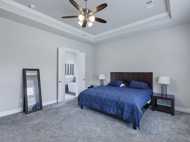 2815 Spring Creek Trl, Celina, TX 75078 - bedroom featuring carpet floors, a raised ceiling, ornamental molding, baseboards, and connected bathroom
