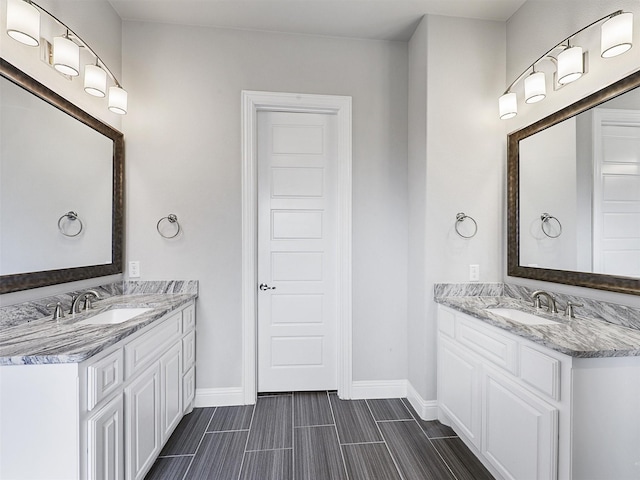 2815 Spring Creek Trl, Celina, TX 75078 - bathroom with two vanities and baseboards