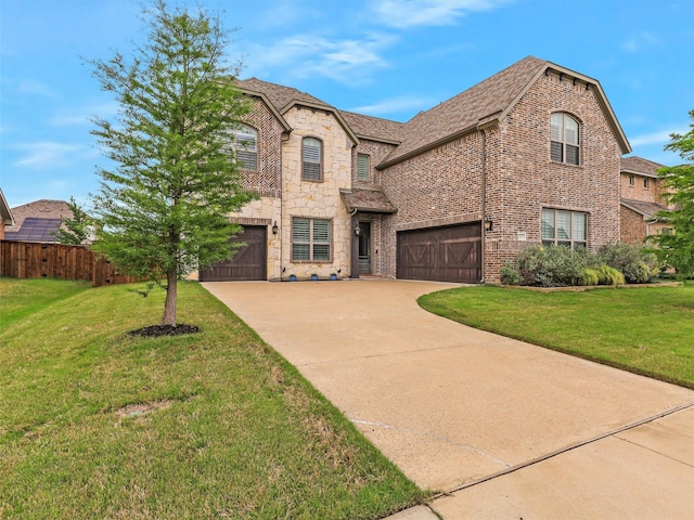 2815 Spring Creek Trl, Celina, TX 75078 - french country style house with concrete driveway, an attached garage, stone siding, and brick siding